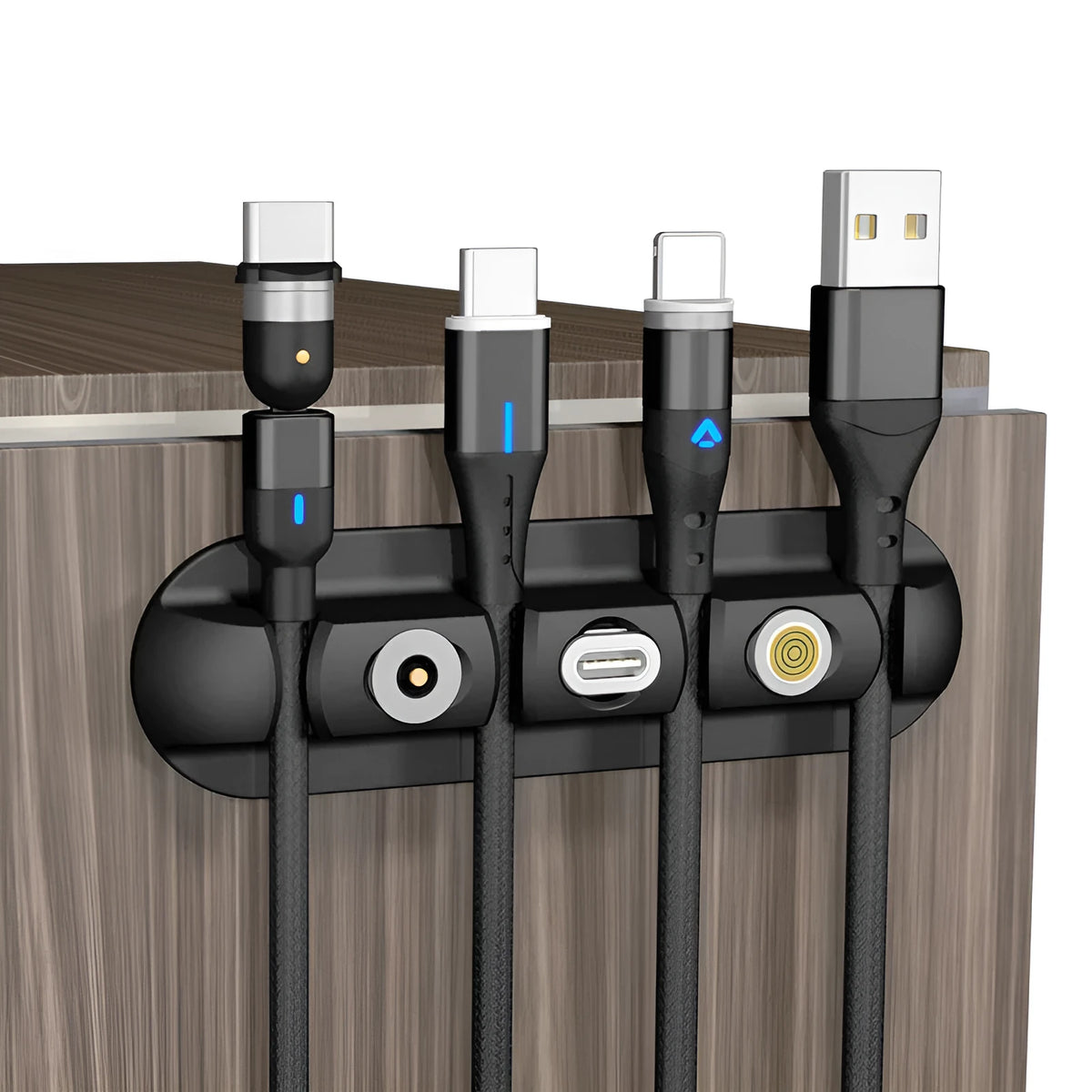 Black soft plastic desktop magnetic charging cable organiser on a desk