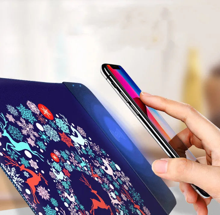 Wireless charging mouse pad with cartoon design and RGB lighting on desk