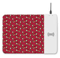 Wireless charging mouse pad with cartoon design and RGB lighting on desk