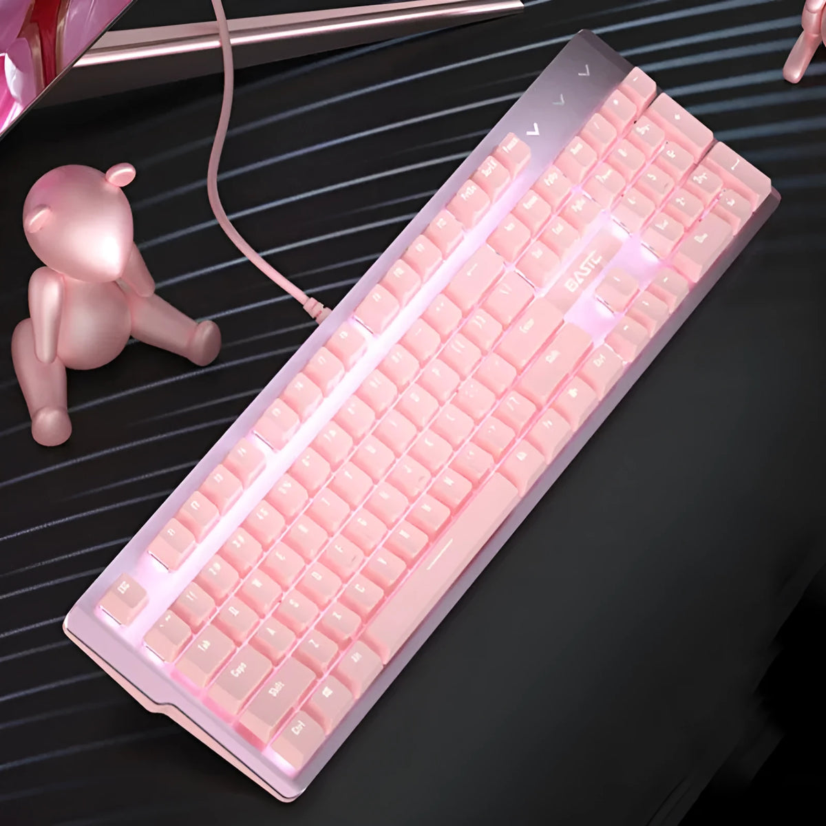 Pink mechanical gaming keyboard and wired mouse set with USB cables on gaming desk