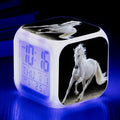 Square cartoon-style alarm clock with LED display showing time and temperature