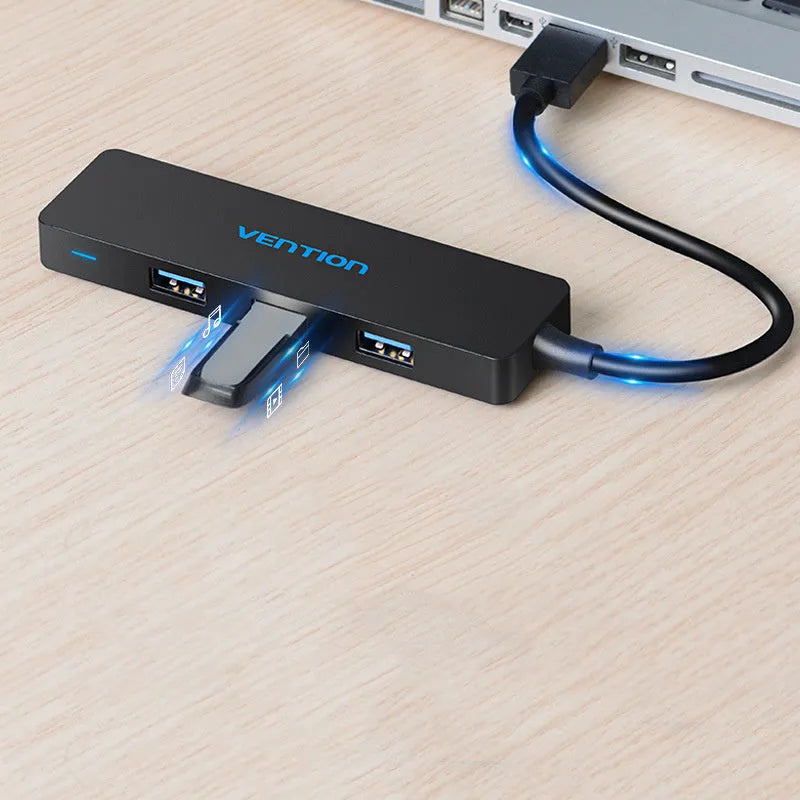 Black four-port USB 3.0 hub with a short cable and nickel-plated ports