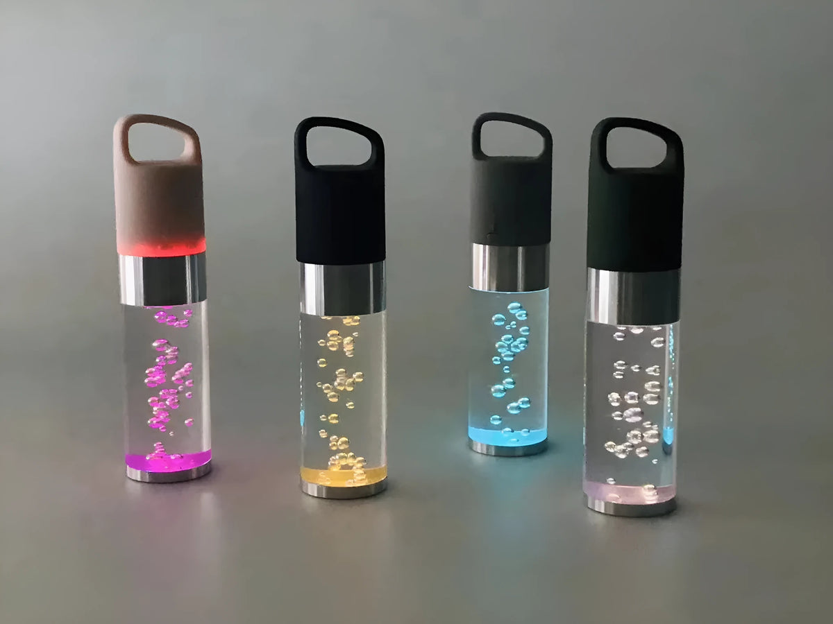 Portable Bluetooth speaker with colourful crystal light in pink, black, silver gray, or green colours