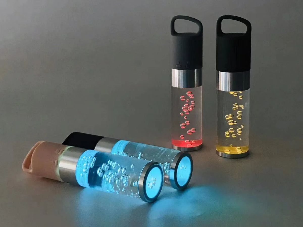 Portable Bluetooth speaker with colourful crystal light in pink, black, silver gray, or green colours