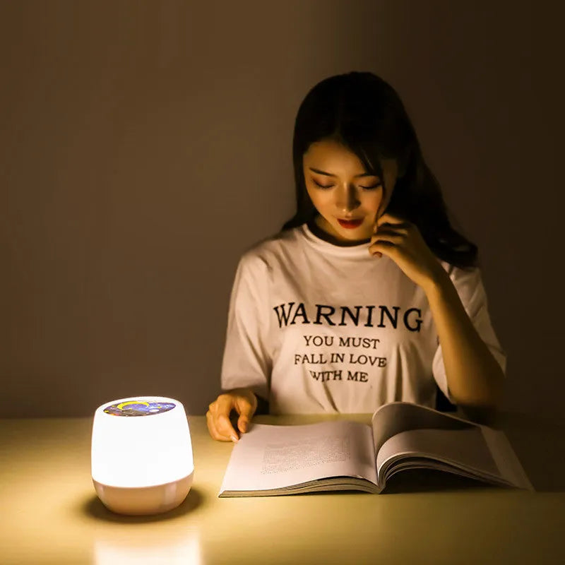 Pruixin LED projector night light projecting rotating starry sky patterns onto a bedroom ceiling