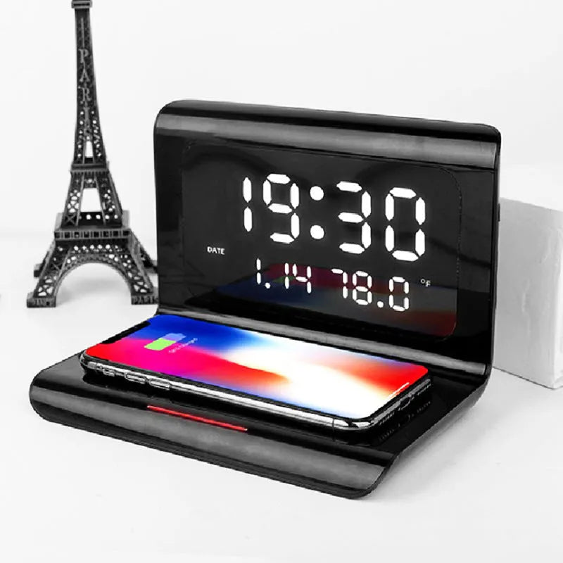 White wireless charger alarm clock showing digital display with time, date, temperature and humidity readings