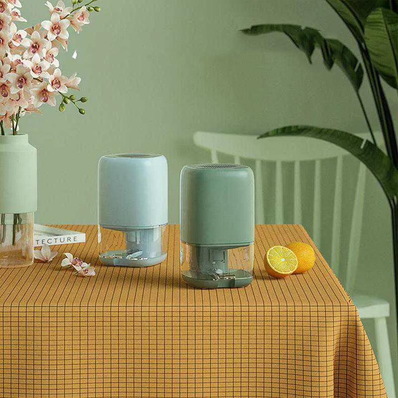Portable dehumidifier in blue colour with 0.7L water tank and international plug adaptors