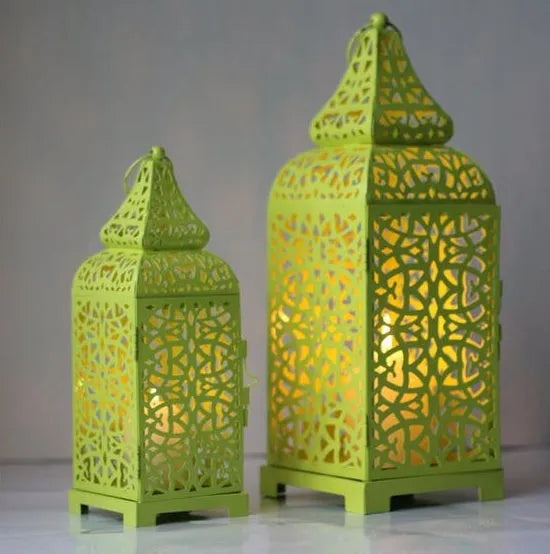 Blue iron candelabra lantern with geometric cut-out pattern measuring 14x14x38 cm
