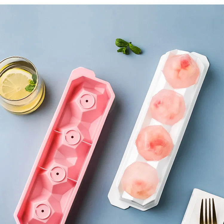Silicone ice tray producing large hockey-shaped ice cubes in light grey colour