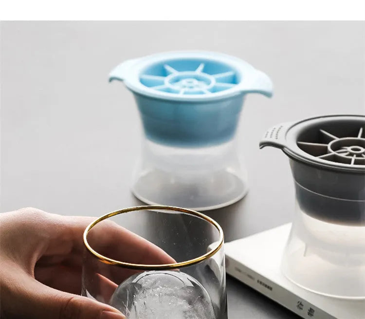 Silicone ice tray producing large hockey-shaped ice cubes in light grey colour
