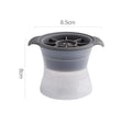 Silicone ice tray producing large hockey-shaped ice cubes in light grey colour