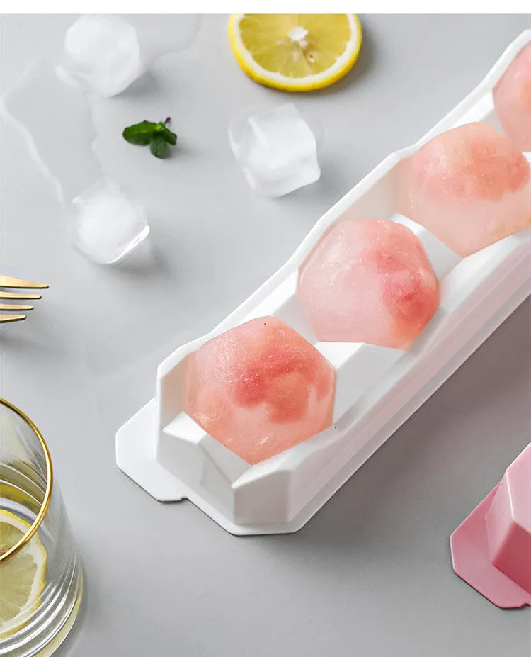 Silicone ice tray producing large hockey-shaped ice cubes in light grey colour