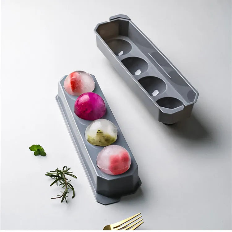 Silicone ice tray producing large hockey-shaped ice cubes in light grey colour