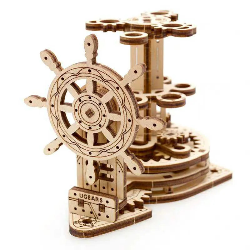 Wooden desk model with a rotating steering wheel holding pens and pencils.