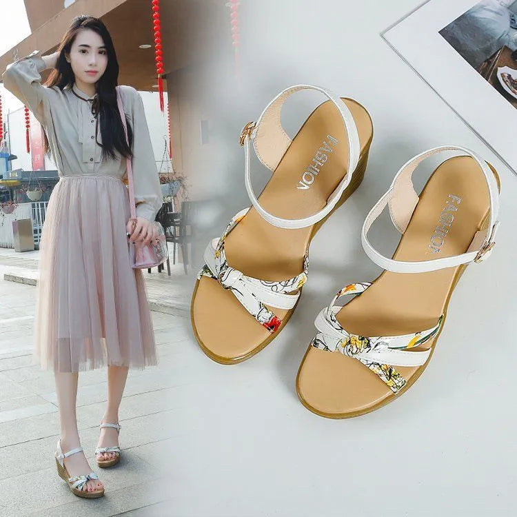 Women's pink wedge sandals with thick heel, fish mouth toe, and buckle closure on a white background