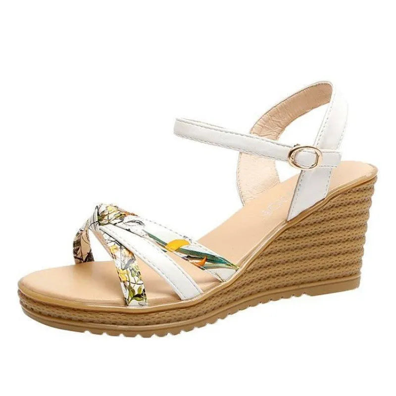 Women's pink wedge sandals with thick heel, fish mouth toe, and buckle closure on a white background