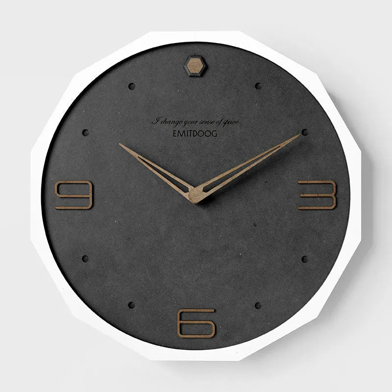12 inch round Nordic minimalist wall clock in walnut ash finish on a light-coloured wall.