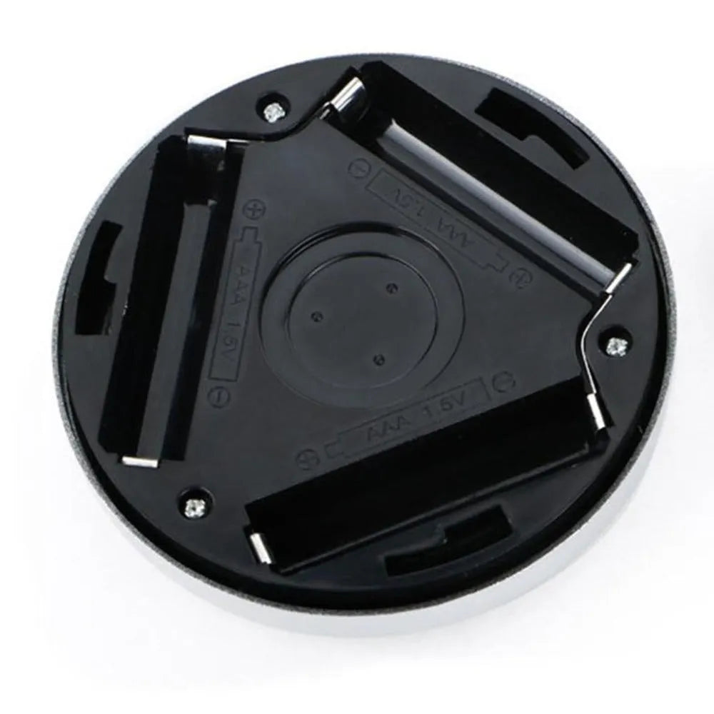Round silver wireless motion sensor night light with battery operation for automatic LED illumination
