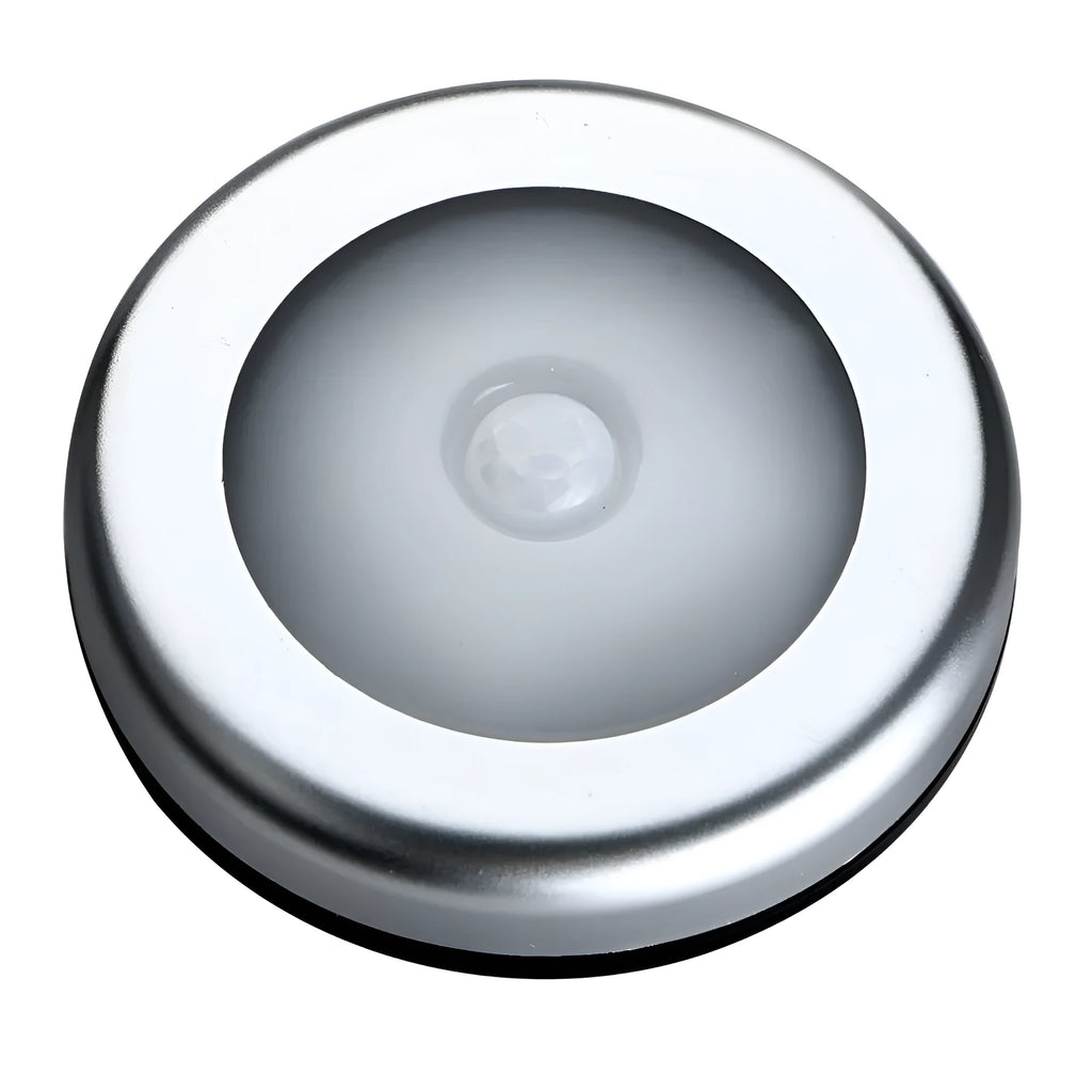 Round silver wireless motion sensor night light with battery operation for automatic LED illumination