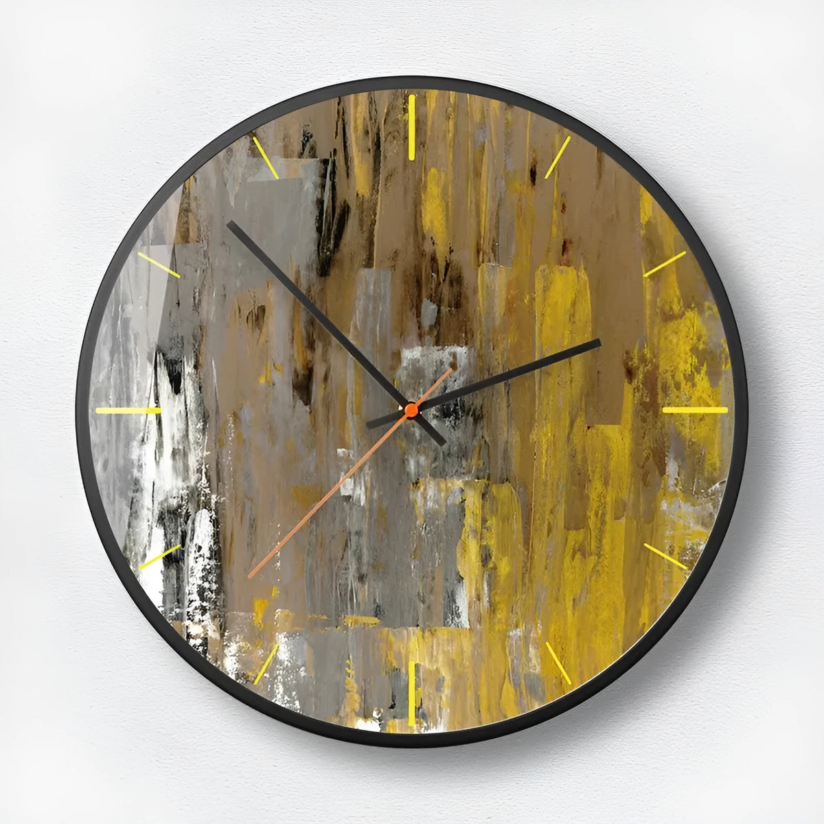 Round abstract art design wall clock with metal case on a wall.
