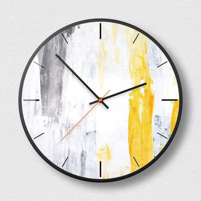 Round abstract art design wall clock with metal case on a wall.
