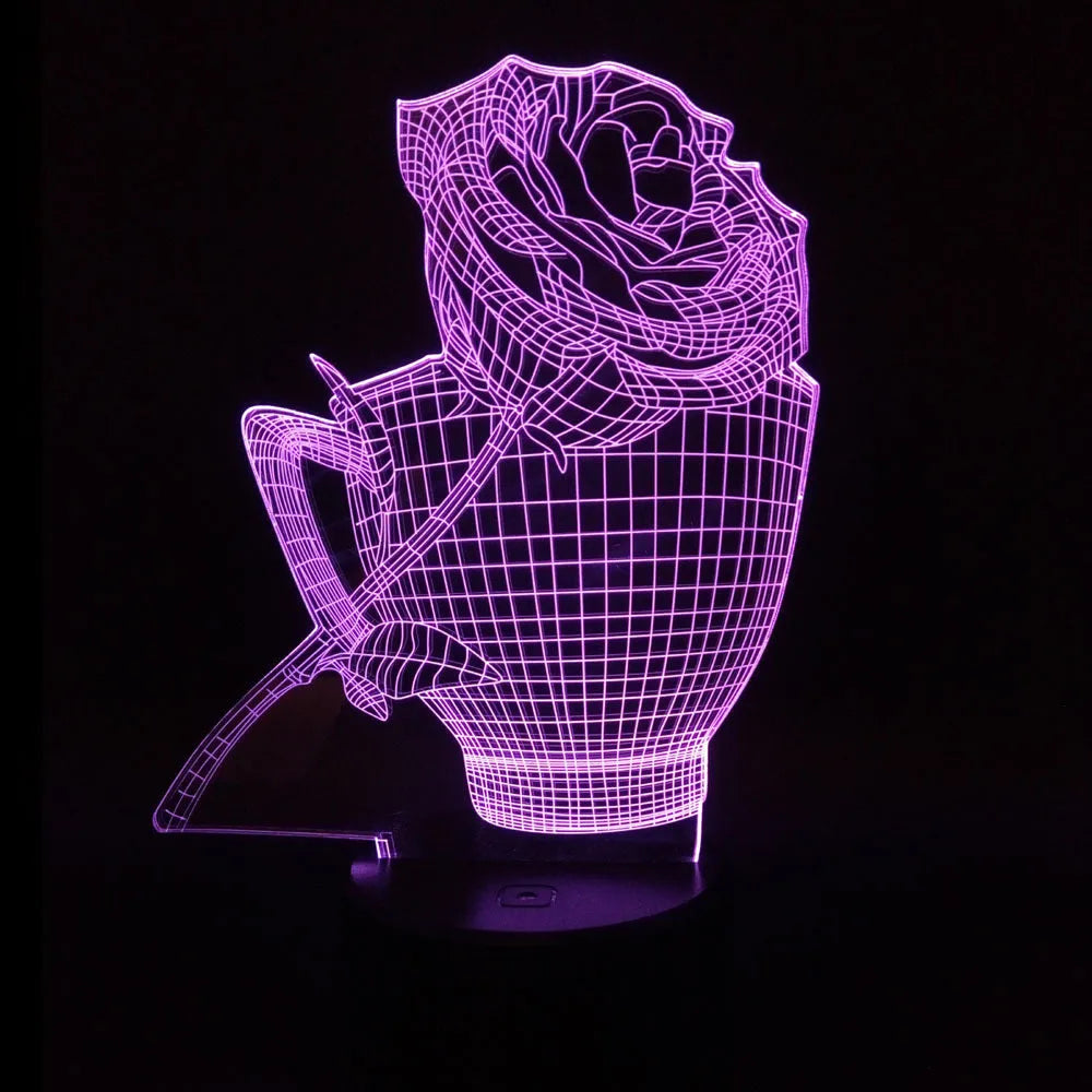 3D rose flower shaped night light with glowing LED colours on a black base, showing remote control.