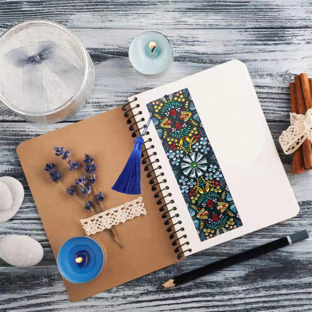 Close-up of a leather bookmark with a hand-embroidered mandala flower design in special-shaped diamond rhinestones.