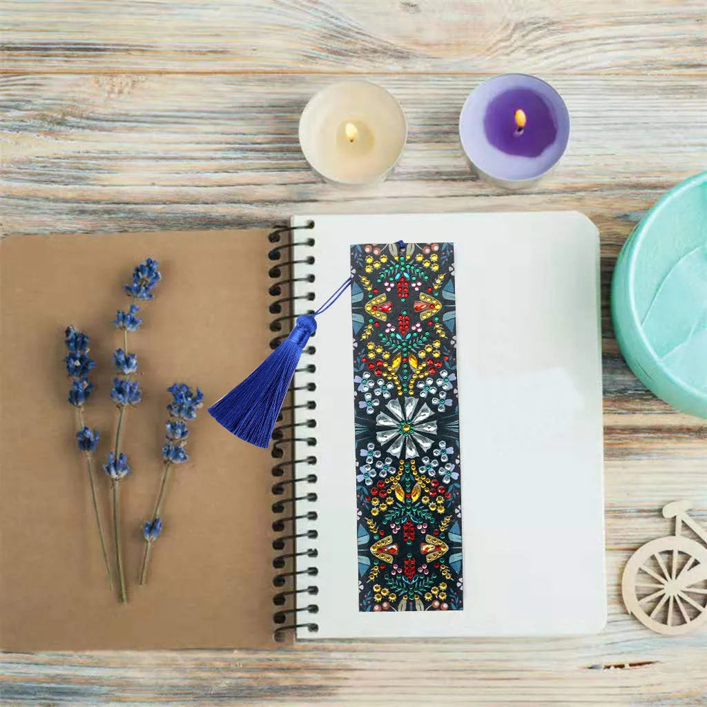 Close-up of a leather bookmark with a hand-embroidered mandala flower design in special-shaped diamond rhinestones.