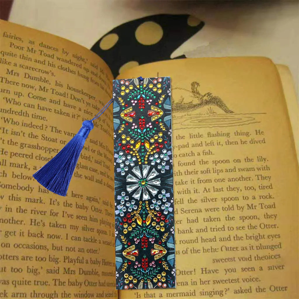 Close-up of a leather bookmark with a hand-embroidered mandala flower design in special-shaped diamond rhinestones.