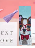 Close-up of a leather bookmark with a hand-embroidered mandala flower design in special-shaped diamond rhinestones.