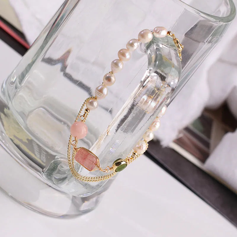 Women's pink freshwater pearl bracelet with strawberry crystal accents in geometric design