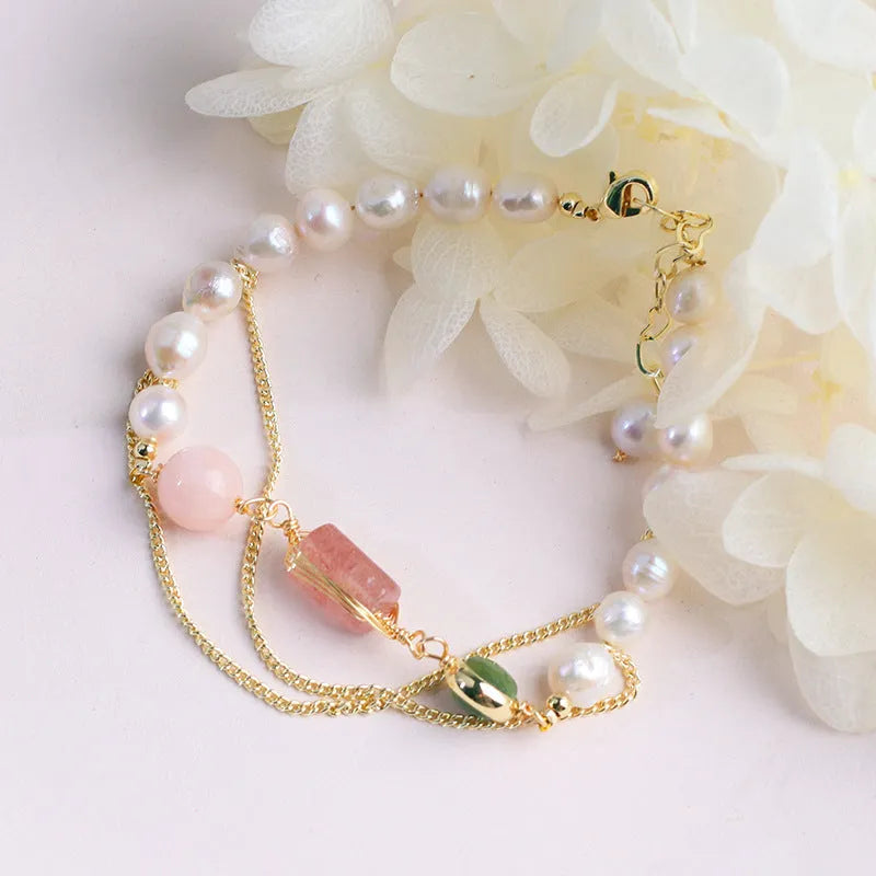 Women's pink freshwater pearl bracelet with strawberry crystal accents in geometric design