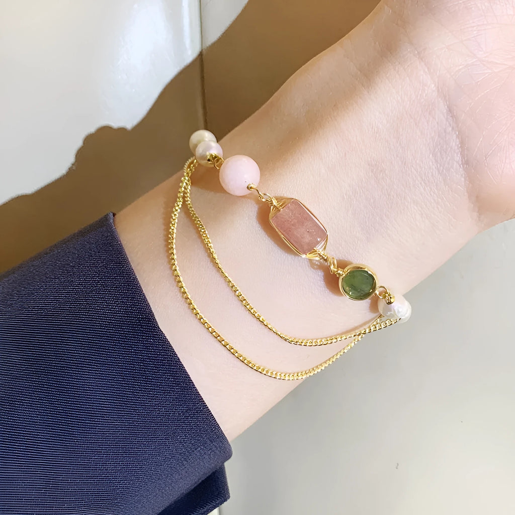 Women's pink freshwater pearl bracelet with strawberry crystal accents in geometric design