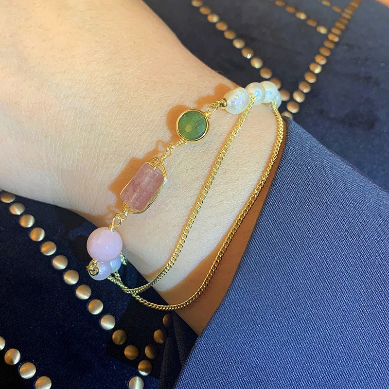 Women's pink freshwater pearl bracelet with strawberry crystal accents in geometric design
