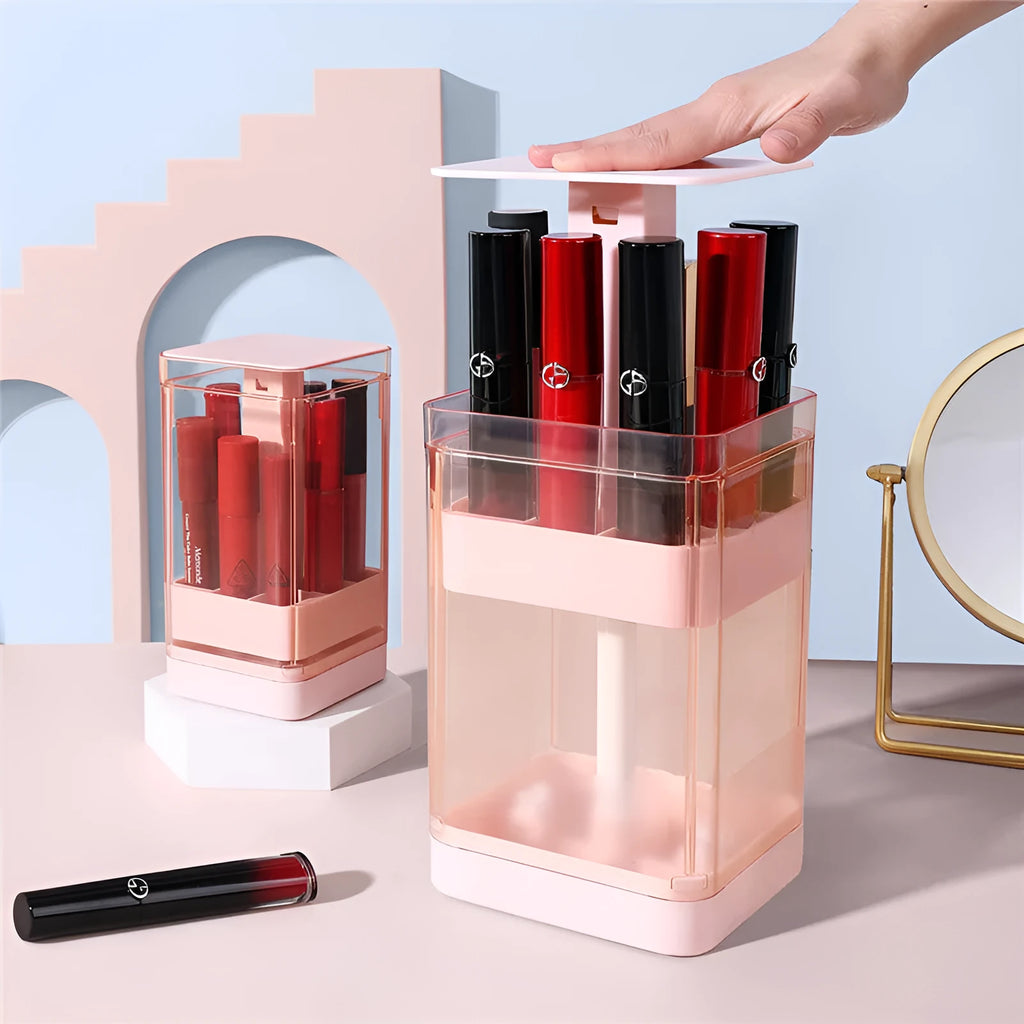 Pink and white desktop lipstick storage box with press-lift lid and clear dust cover.