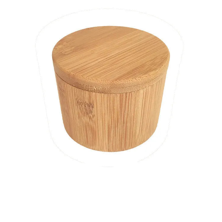 Bamboo seasoning box and spoon for kitchen spice storage.
