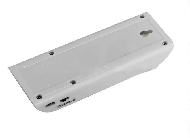White rechargeable LED night light with infrared motion sensor on a wall.