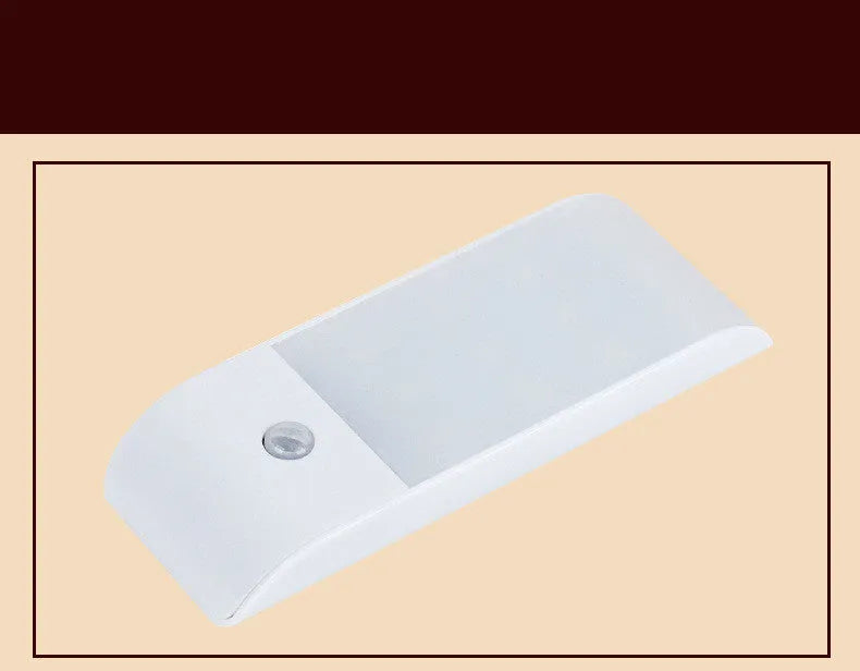 White rechargeable LED night light with infrared motion sensor on a wall.