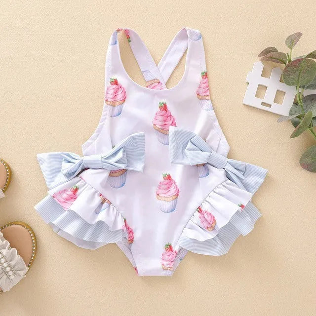 Girls white print sundress shown in sizes 80cm to 130cm, suitable for ages 3 months to 14 years
