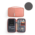 Small and large waterproof passport covers in black, blue, grey, pink, and sky blue.