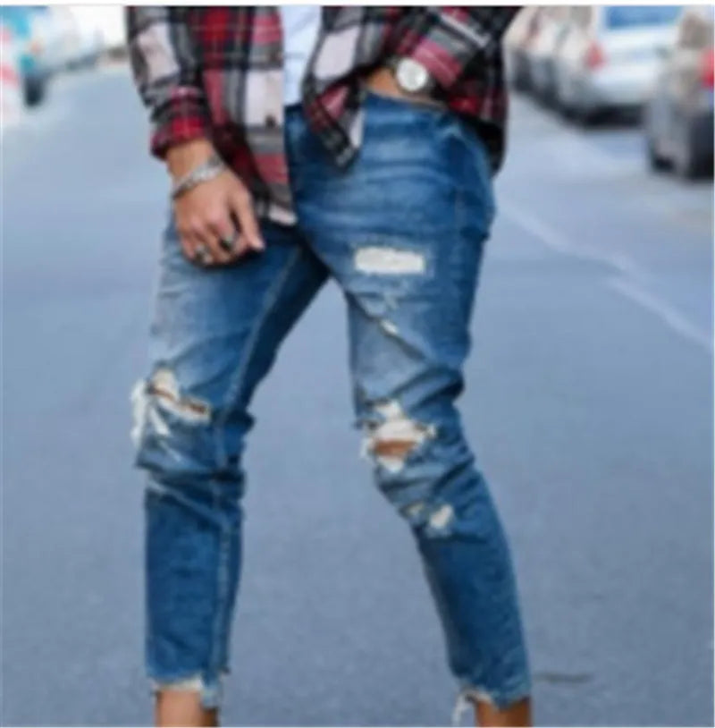 Men's distressed jeans in a deep blue wash on a size chart