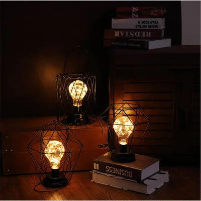 Iron hollow table lamp in bottle style with warm white LED illumination