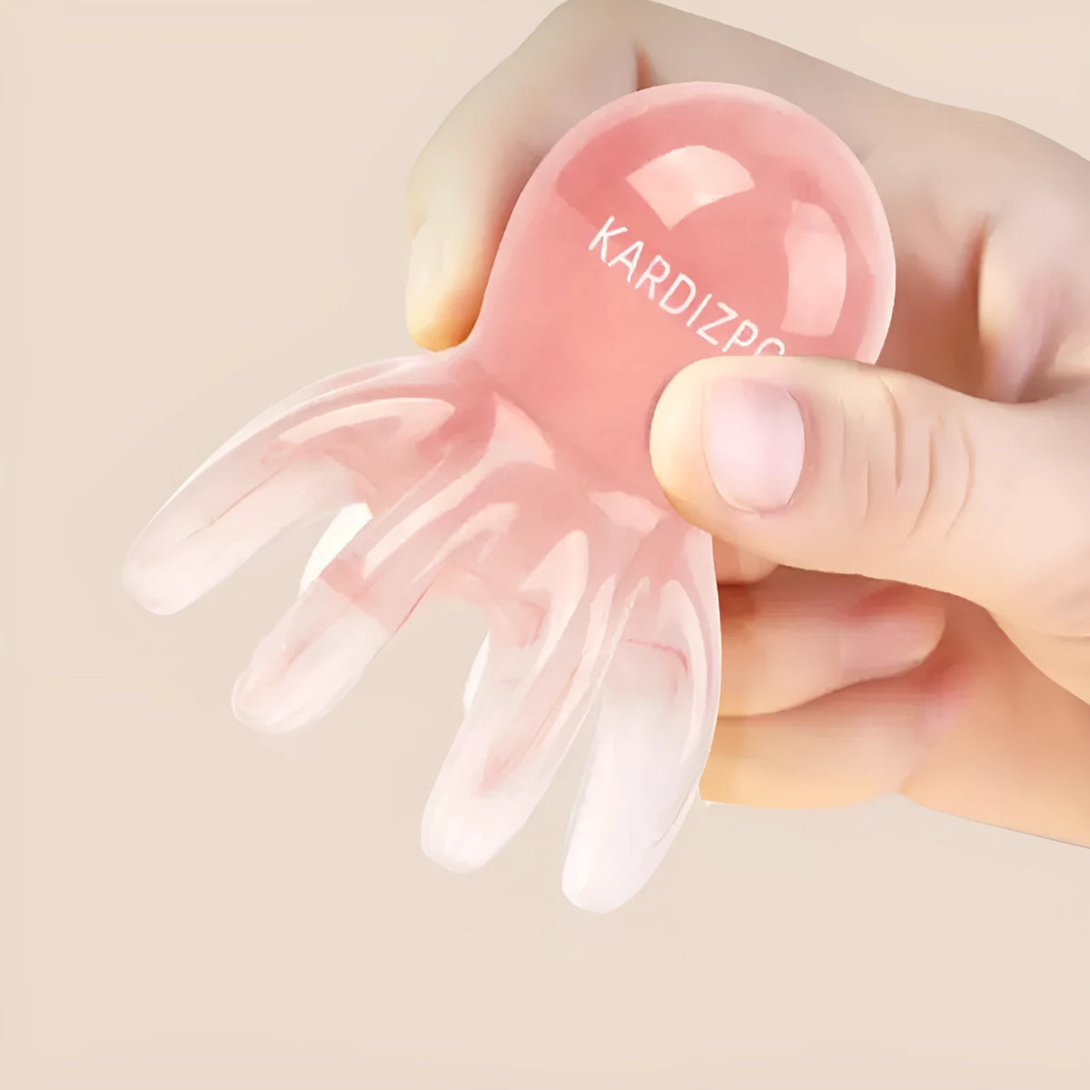 Pink octopus-shaped massage comb made from natural resin with included storage bag for facial meridian therapy