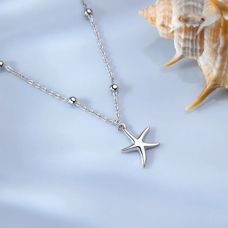 S925 sterling silver anklet with simple round beads and a central starfish charm for women.