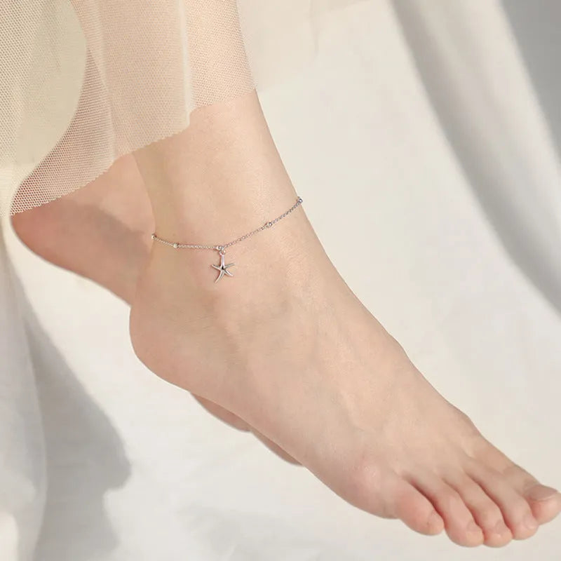 S925 sterling silver anklet with simple round beads and a central starfish charm for women.