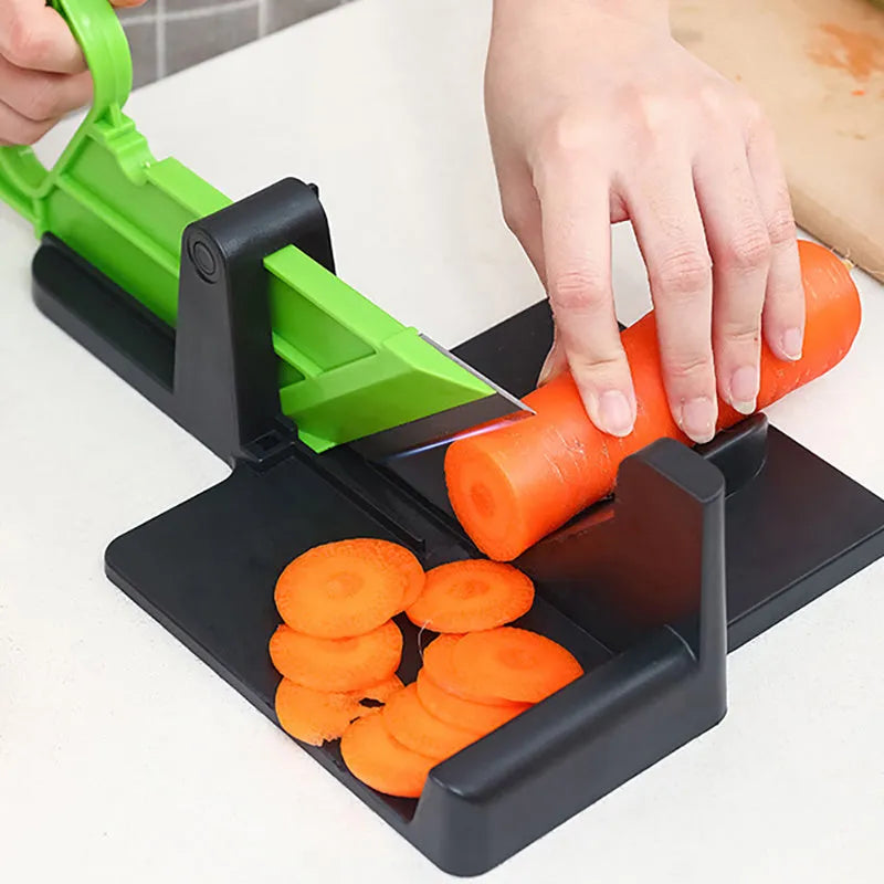 Green vegetable cutter with stainless steel blades for cutting carrots and potatoes