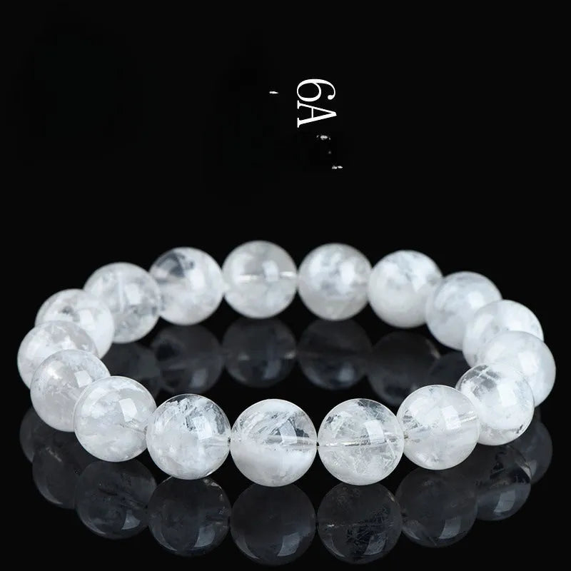 Women's crystal bracelet with round blizzard snowflake beads and ruyi xiangyun charm.
