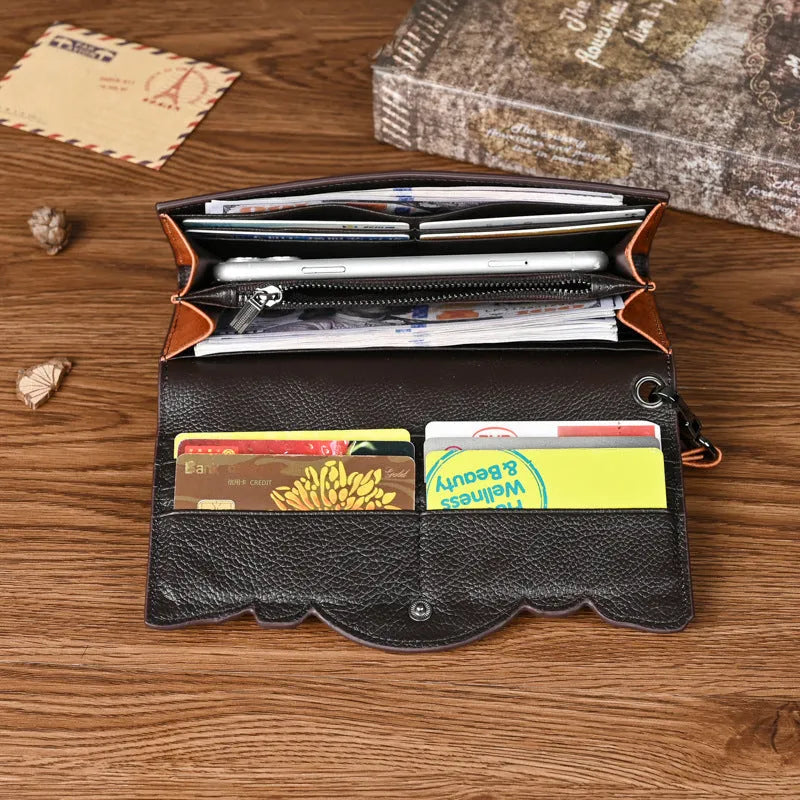 Women's brown embossed floral genuine leather tri-fold wallet showing interior compartments
