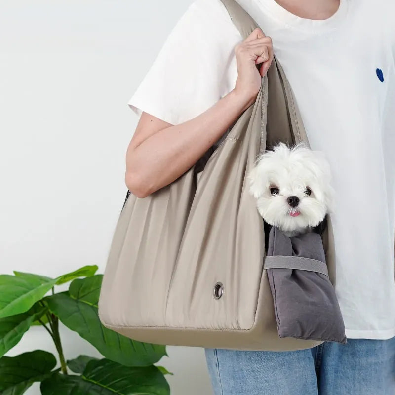 Apricot coloured cloth pet handbag carrier with shoulder strap for small dogs or cats.