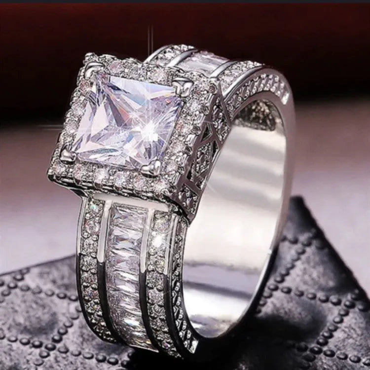 Geometric round design women's engagement ring in gold or white colour with angular patterns